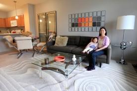 Elaine Lau, with daughter Violet, moved with her husband, Jonathan Proman, to the new Harrison Station complex, which will ultimately have 2,250 residences. Photo: Jennifer Brown for the New York Post